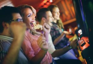 A happy lady just won money at a casino while playing slots, now she will need to claim her tax refund